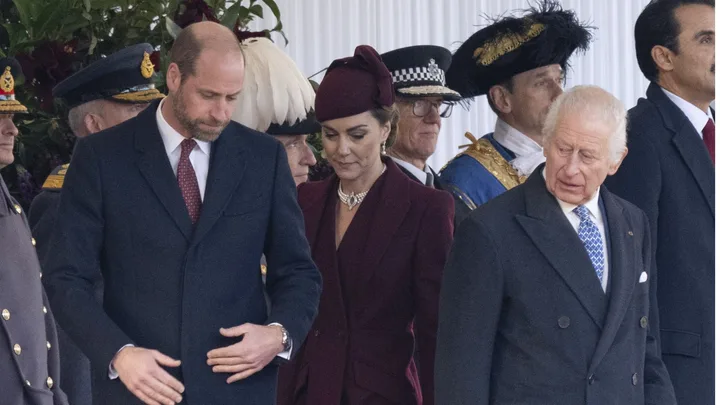 Unsmiling Prince William, Princess Kate and King Charles