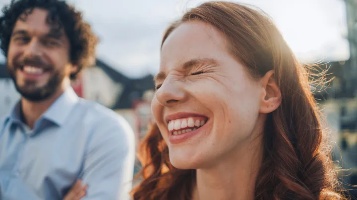 a woman smiled next to her male partner