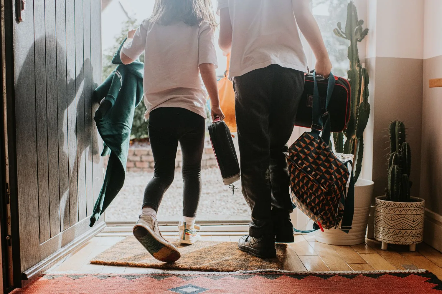 kids leaving a front door