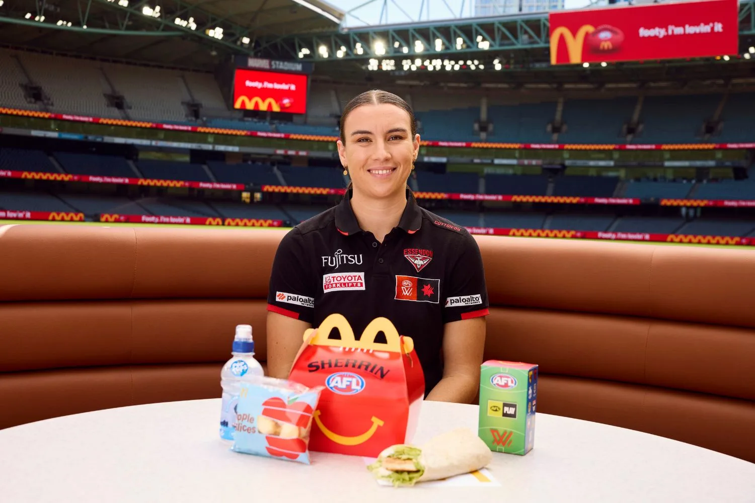 Essedon AFLW player Bonnie Toogood with McDonald's Happy Meal
