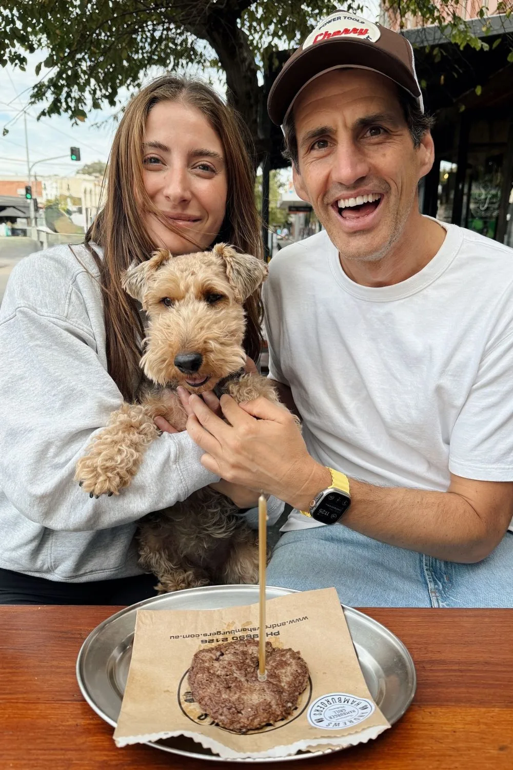 Rebecca Harding, Andy Lee cuddling their beloved dog on her 4th birthday