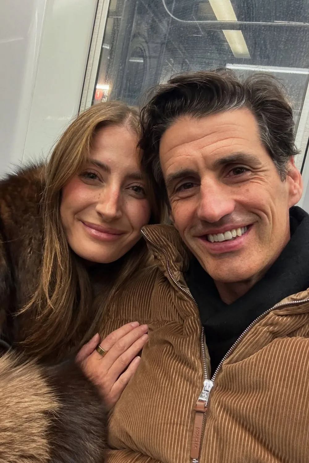 Rebecca Harding and Andy Lee cuddled up together in cosy outfits