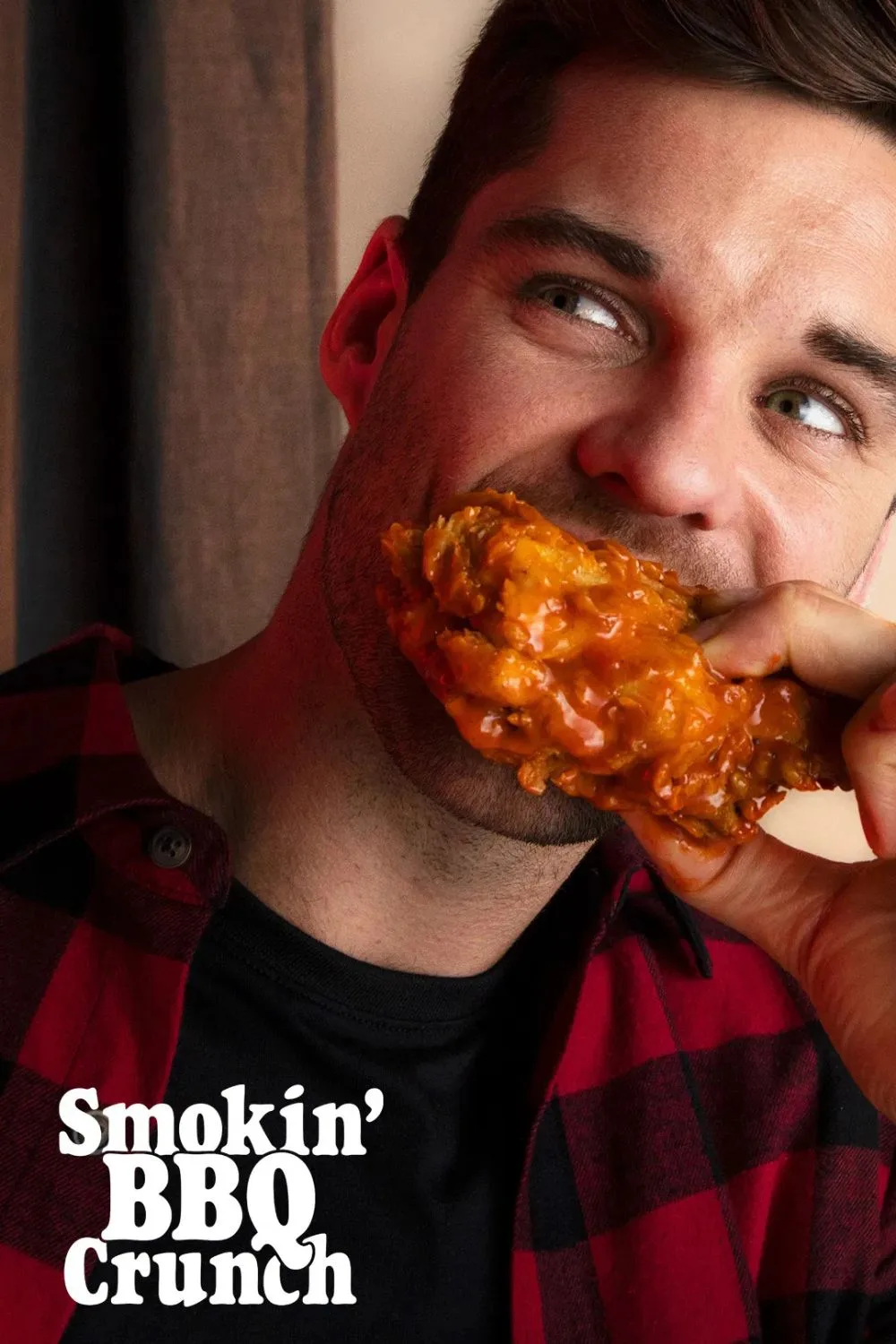 man eating red rooster chicken