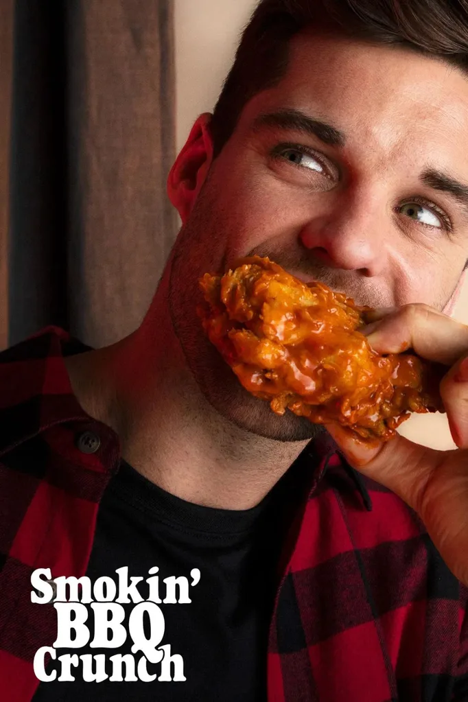 man eating red rooster chicken