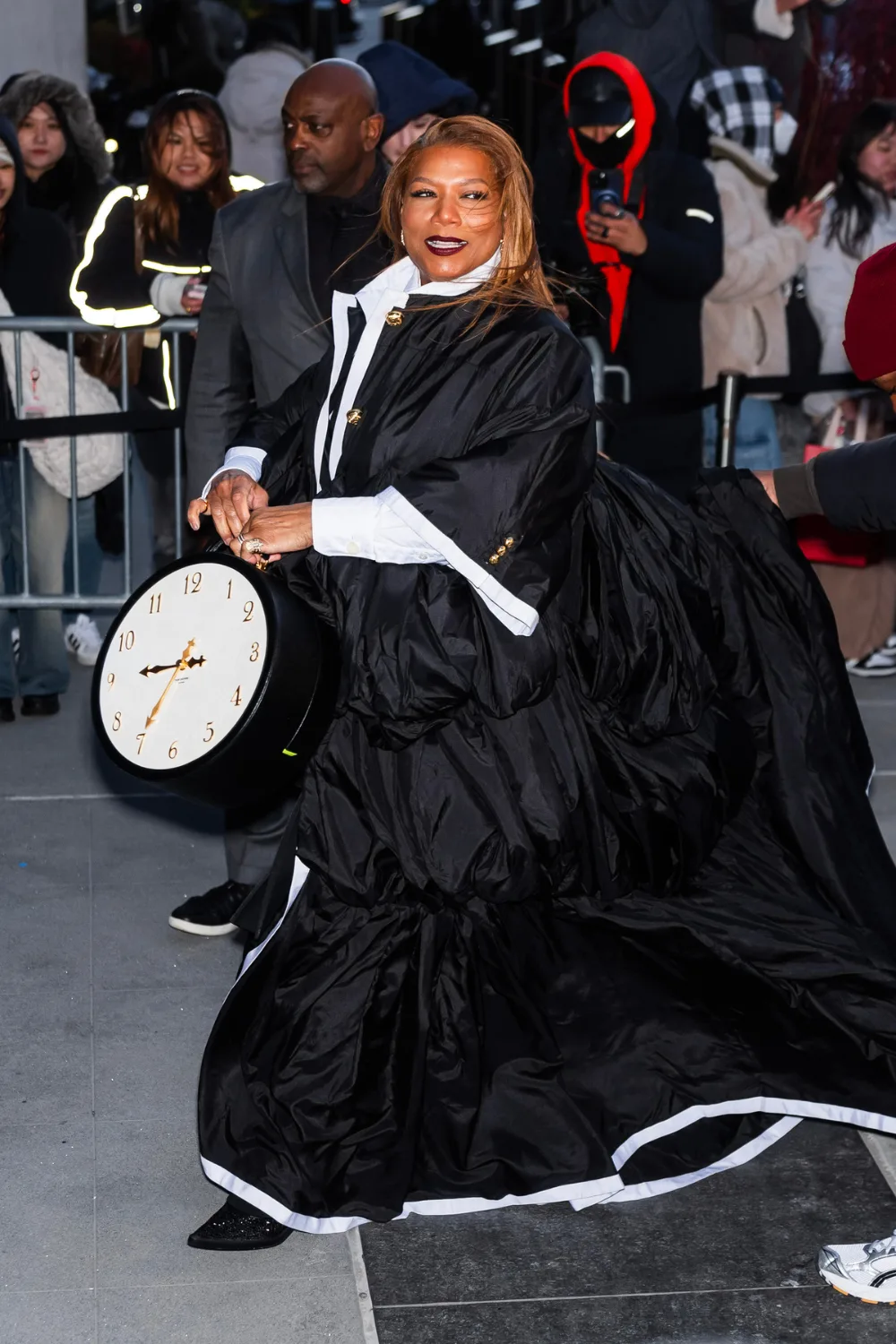 Queen Latifah with clock