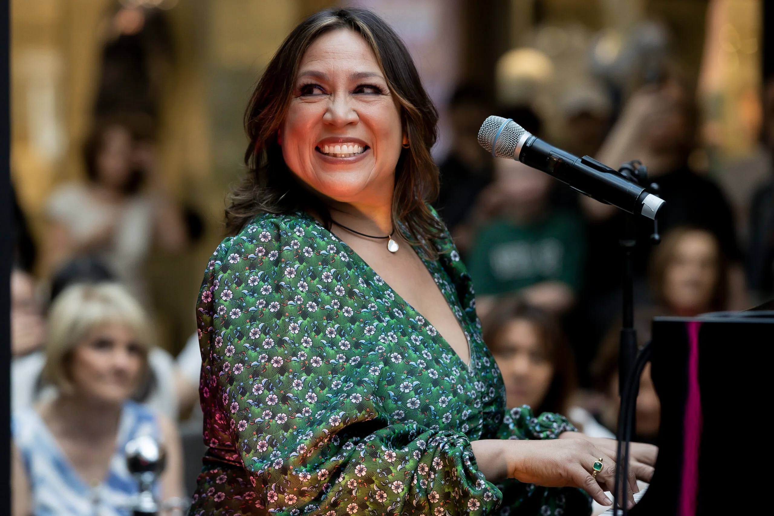 Kate Ceberano in front of a microphone