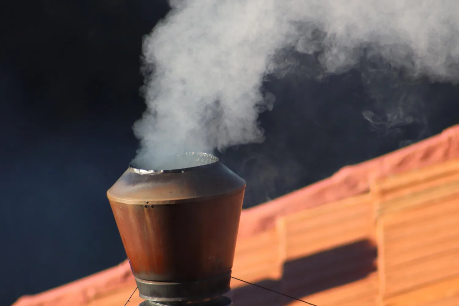 white smoke from chimney in conclave process Canva