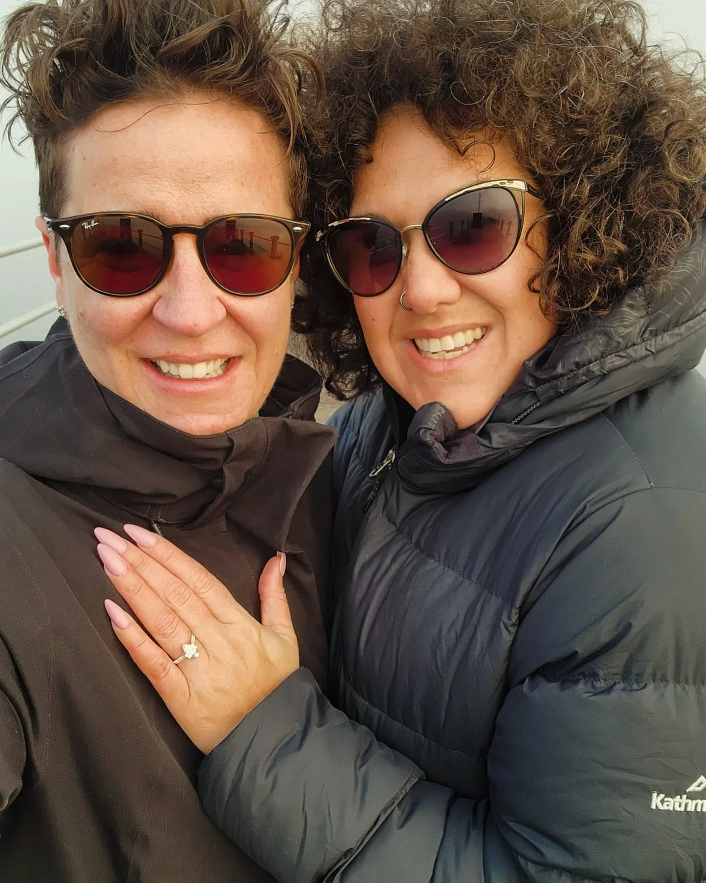 Casey Donovan wearing sunglasses next to her fiancee ReneeSharples.