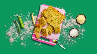 Zucchini loaf with various ingredients around it