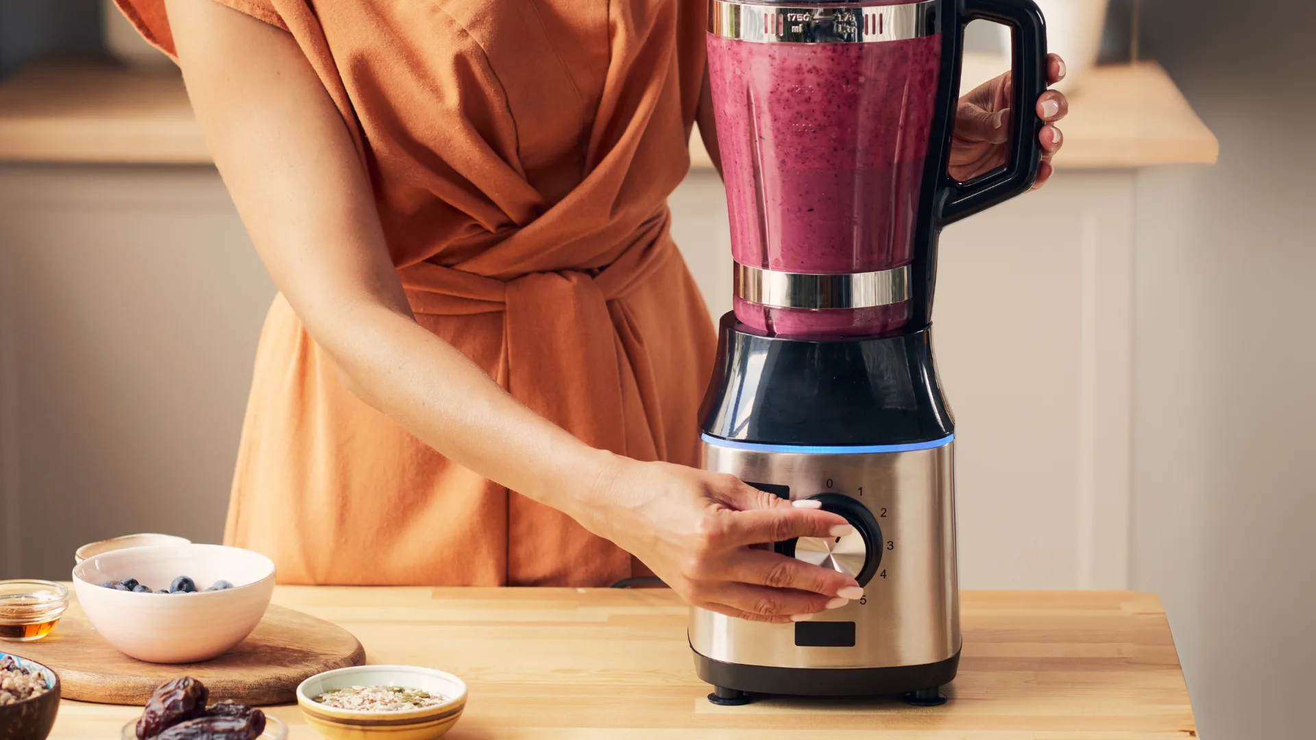 A woman making a smoothie