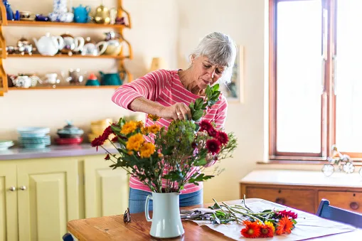 Woman arranging flowers
