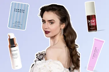 Lilly Collins surrounded by beauty products