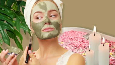 Women applying mud facial in diy home spa
