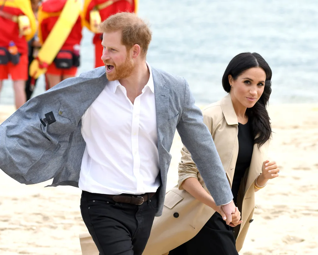 Prince harry and Meghan on a beach