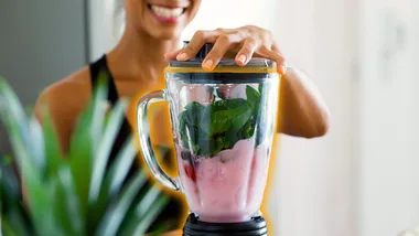Woman blending a smoothie