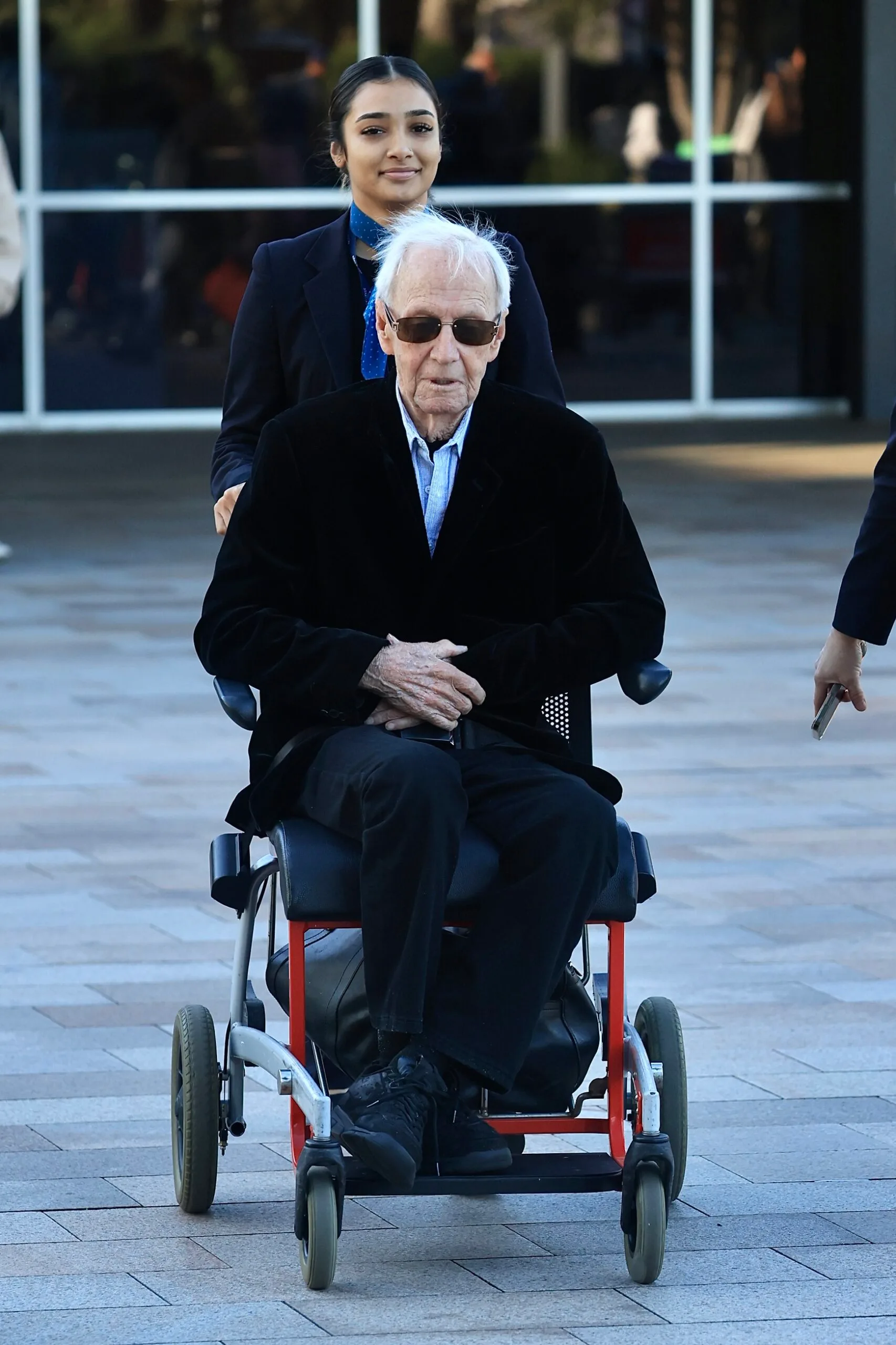 Paul Hogan in a wheelchair