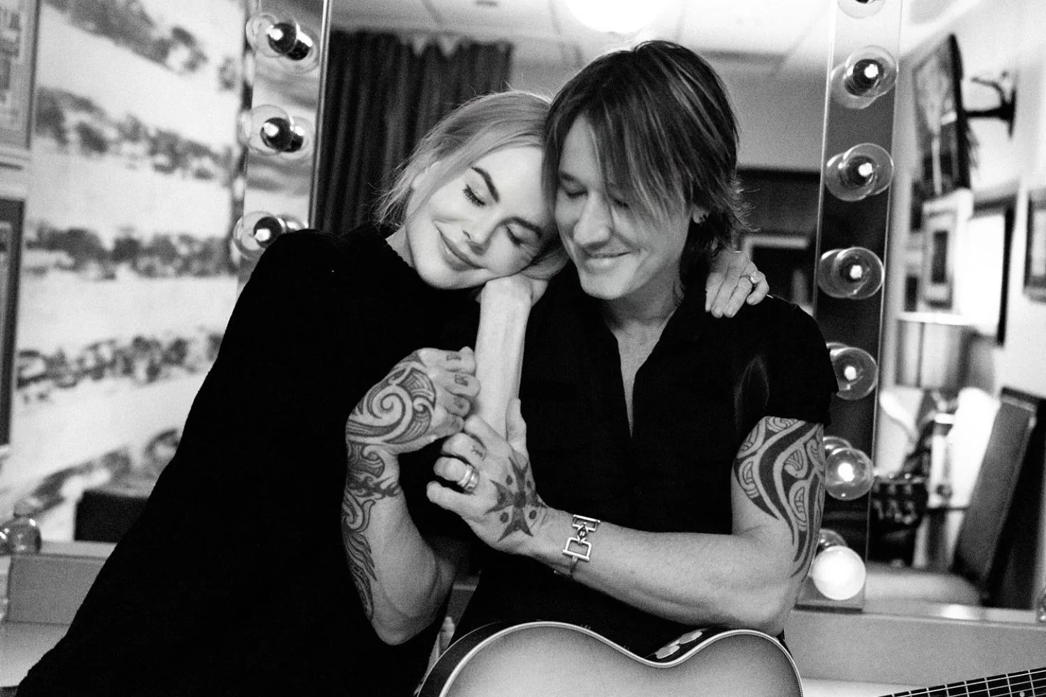 A black and white photo of Nicole Kidman and Keith Urban embracing