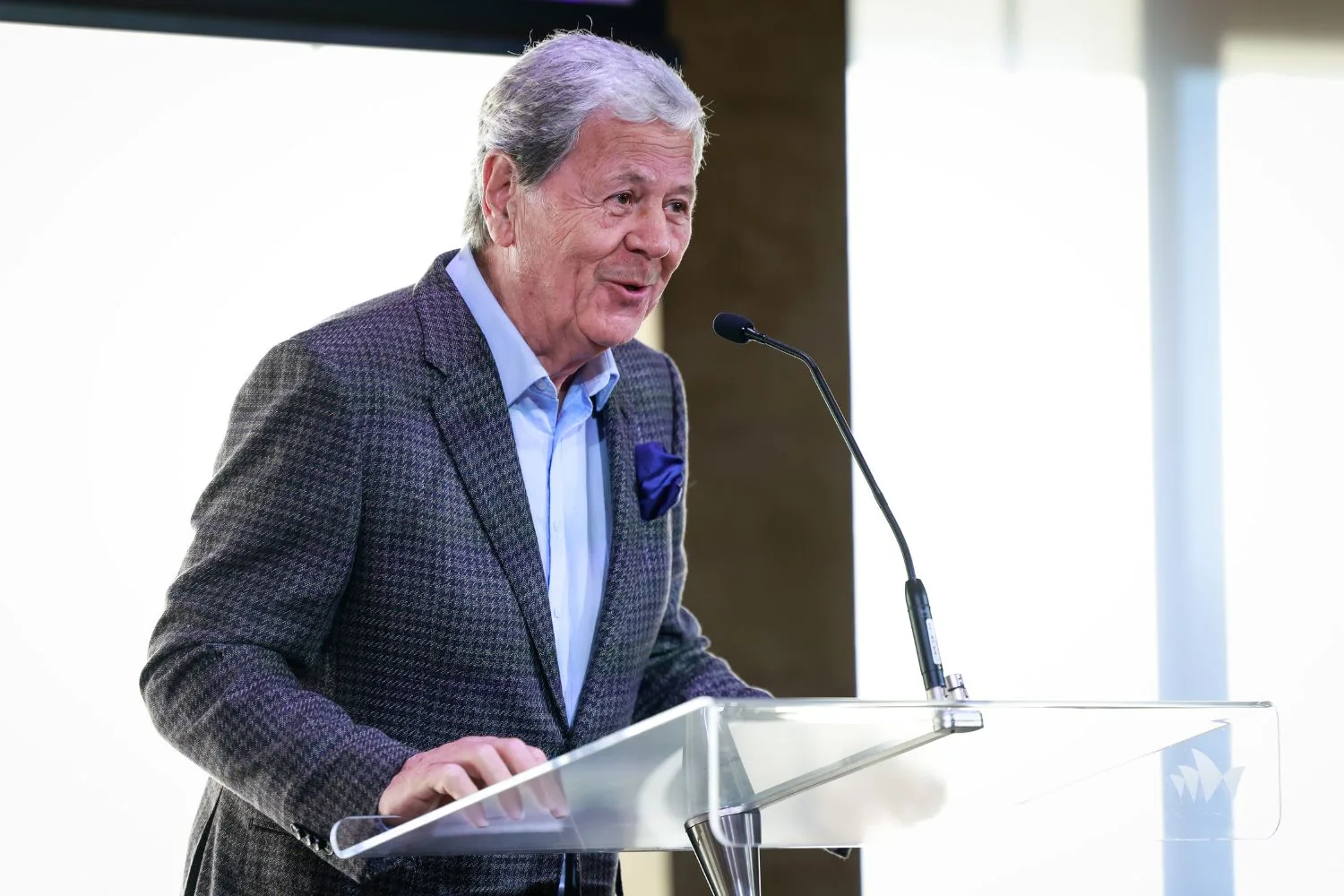 Ray Martin pictured at a lectern giving a talk