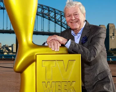 Ray Martin with a giant Logie and with his grandchildren and dog