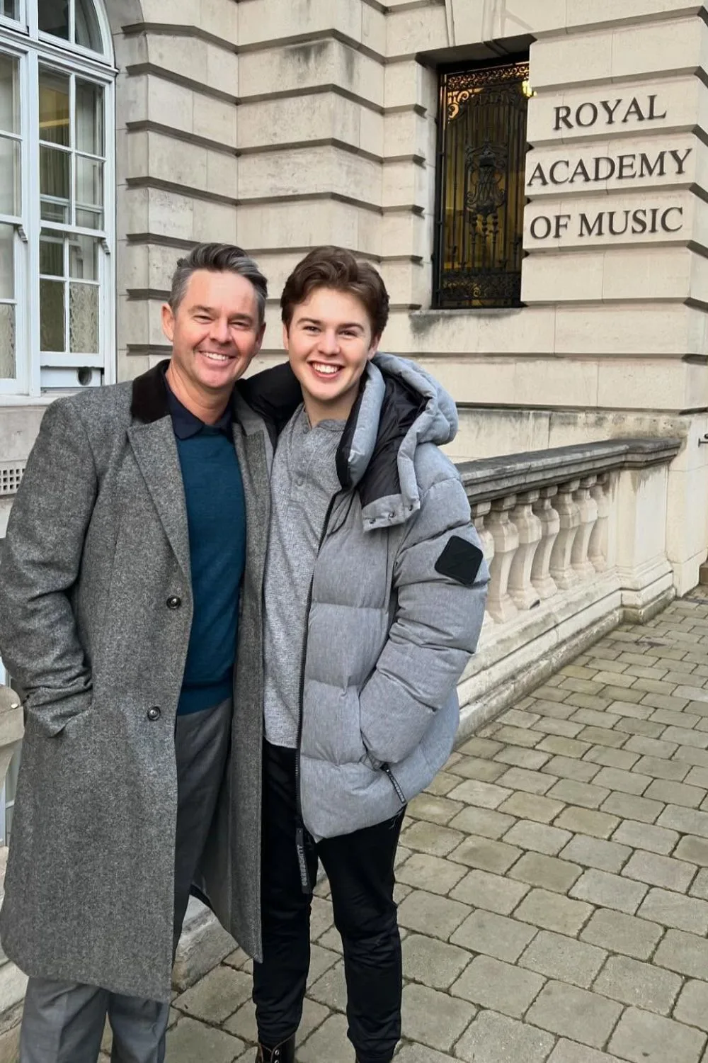 Todd Woodbridge with his son, Beau outside the Royal Academy of Music