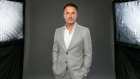 Julian McMahon’s wife Kelly Paniagua chokes back tears during emotional AACTAs tribute