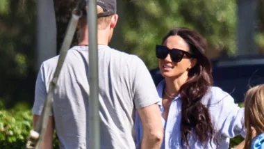 Prince Harry from behind and Meghan