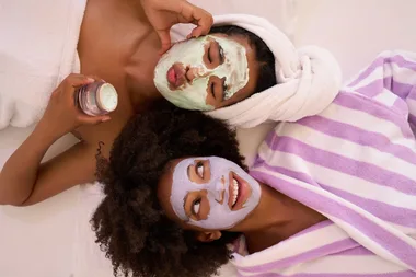 two girls wearing nalia skin face mask