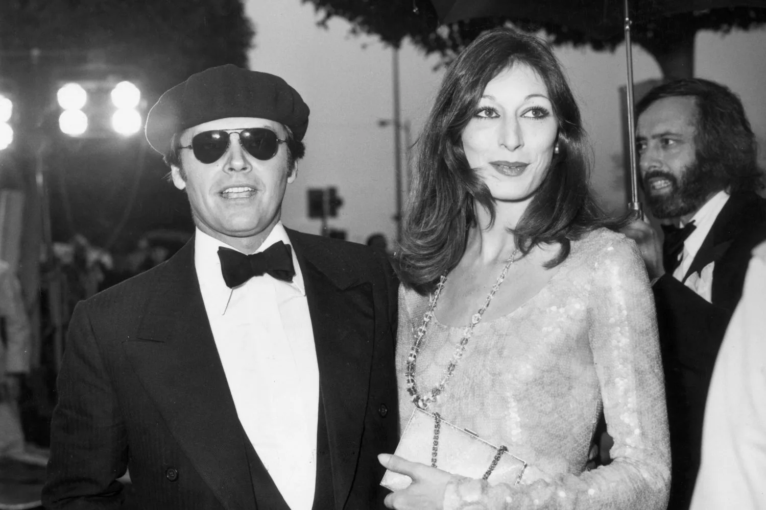 A black and white photo of Anjelica Huston with Jack Nicholson