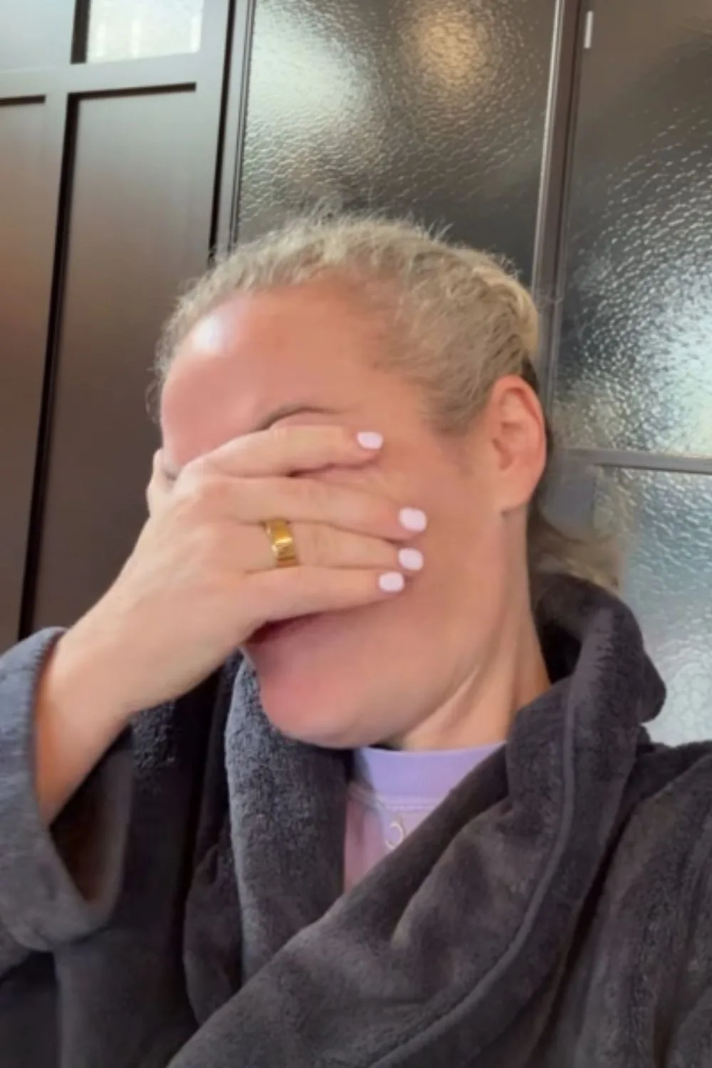 Ash Pollard with her head in her hands after being targeted by thieves