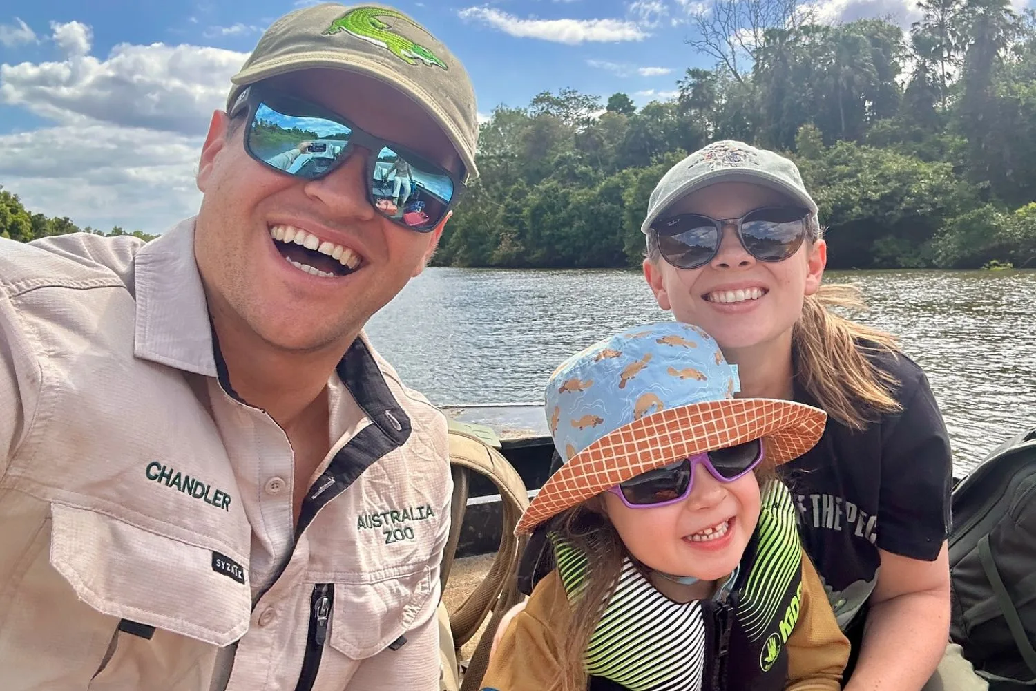 Bindi Irwin's daughter Grace with her parents on a boat during a crocodile research trip