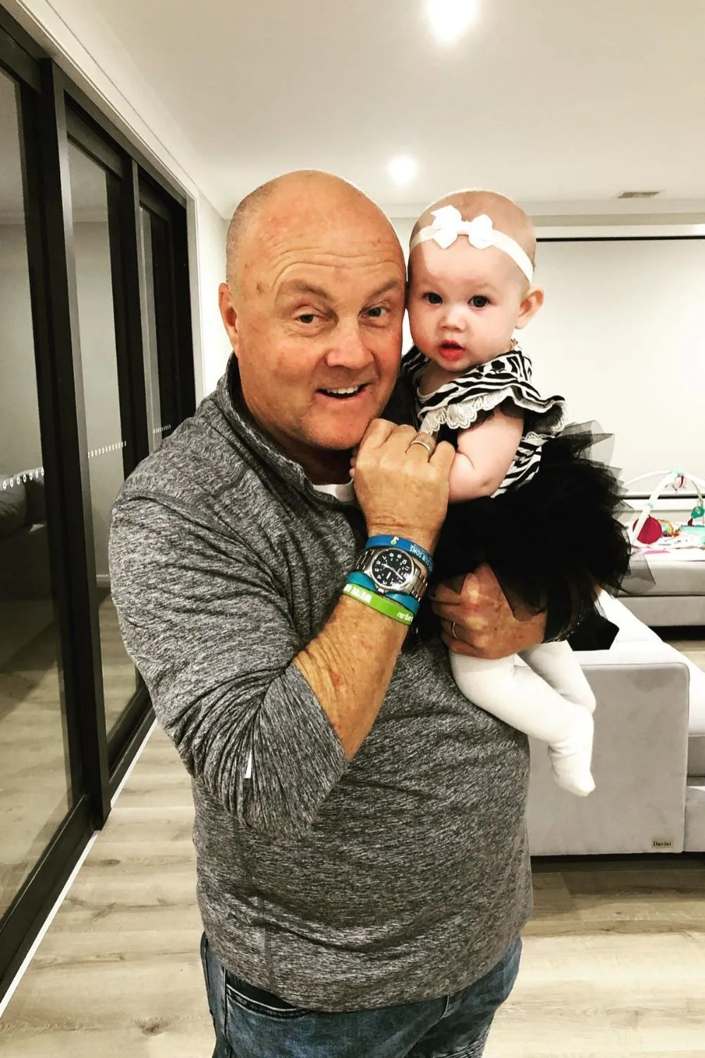 Gogglebox star Keith holding one of his grandchildren