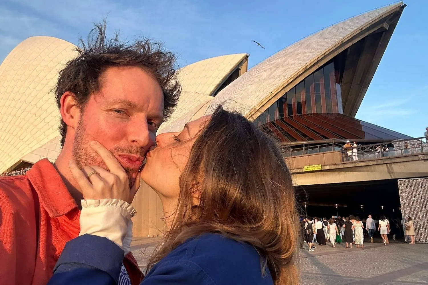Guy Montgomery and fiance Chelsie  Preston Crayford share a kiss outside Sydney Opera House