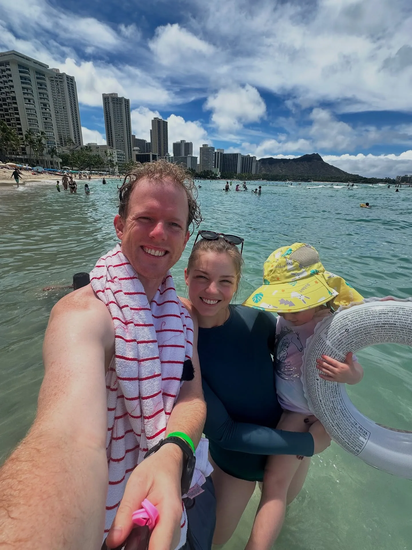 Adam from Gogglebox in the sea with his wife and daughter on holiday