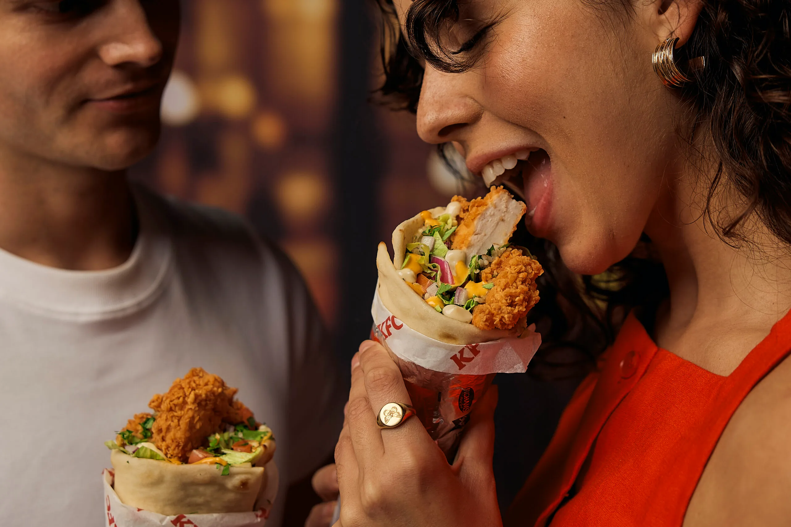 Woman eating a Zinger Kebab