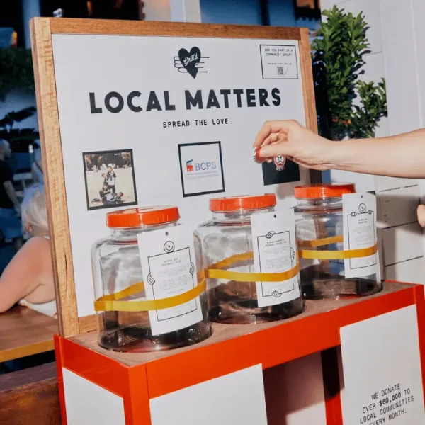 Grill'd Local Matter jars with tokens being placed inside