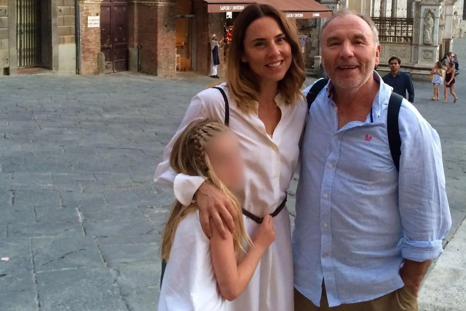 Mel C embraces her daughter and her father on holiday