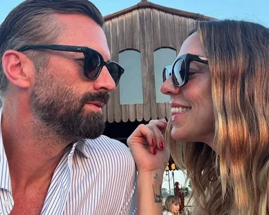 Mel C gazes at boyfriend Chris Dingwall, and stands with her hands on her head