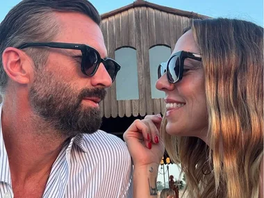 Mel C gazes at boyfriend Chris Dingwall, and stands with her hands on her head