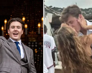 Prince Christian waves at the crowd and kisses his girlfriend at a music festival