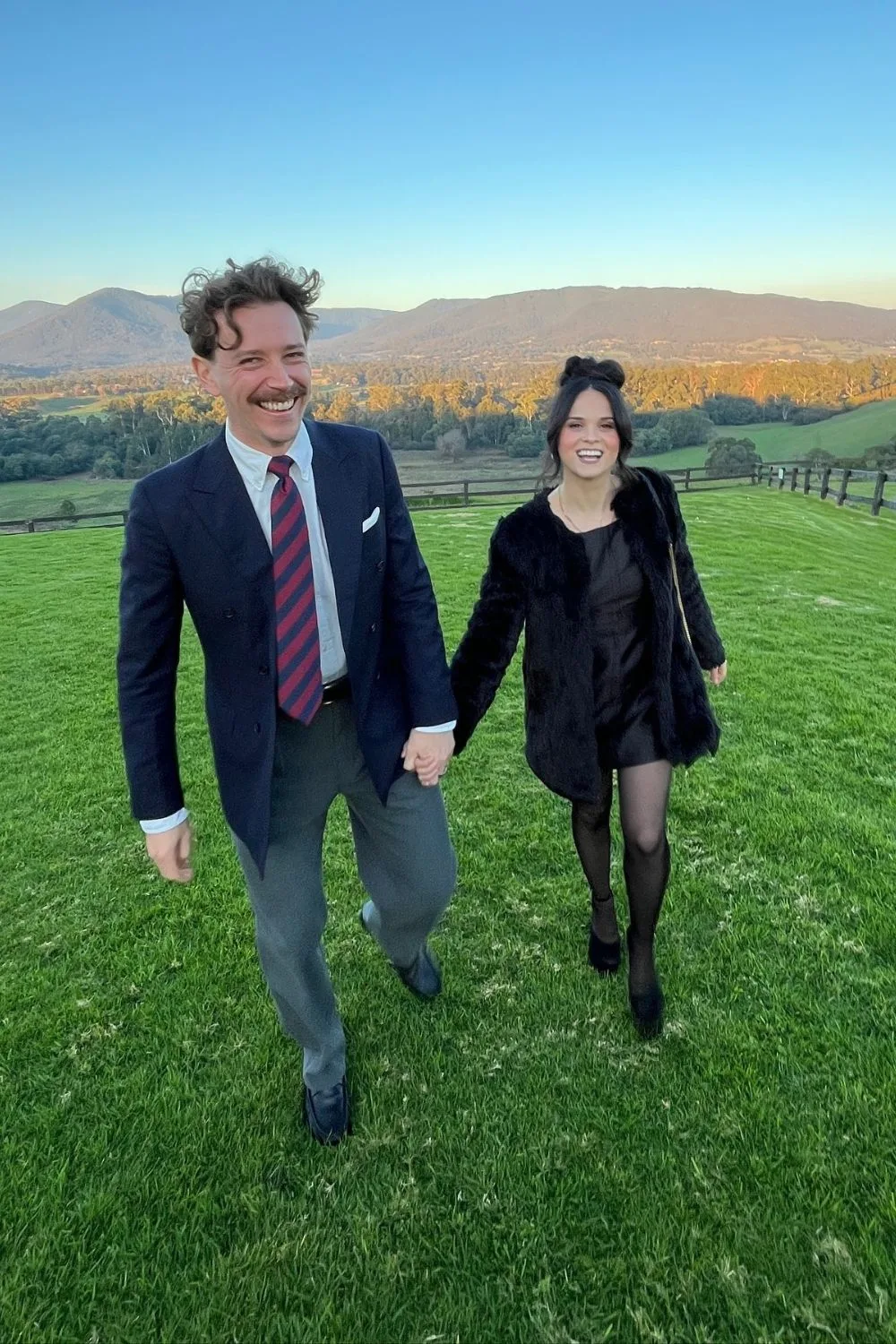 Symon from Gogglebox walking hand in hand with wife Gabriella in a field 
