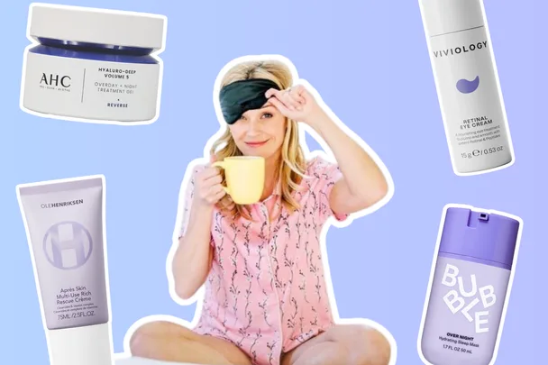 Reese Witherspoon in pyjamas and sleep mask holding a mug surrounded by nighttime beauty products