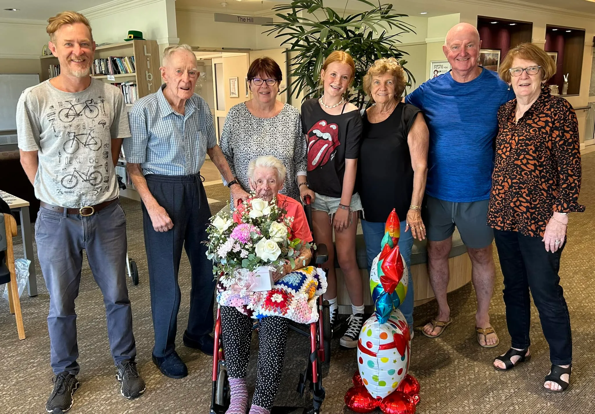 Delma and Frank with their family, including daughters Joy [ 3rd from left] and Sandra [far right], on Delma's 100th birthday