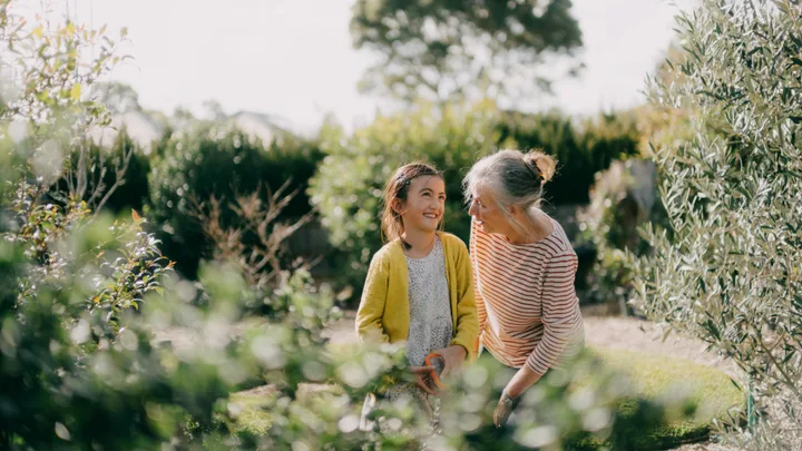 grandma and granddaughter in the garden