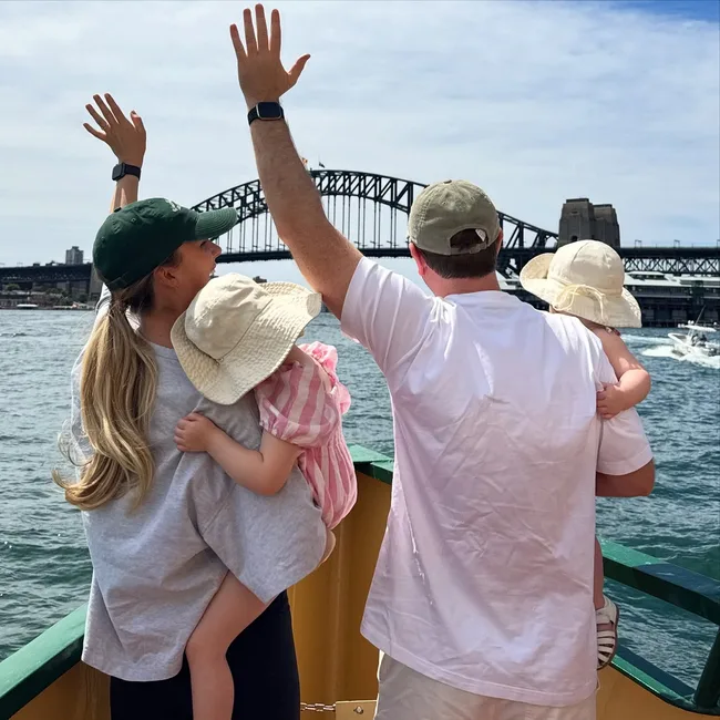 Sam Mac and Rebecca James with daughters in front of Sydney Harbour Bridge