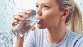 Woman drinking sparkling water
