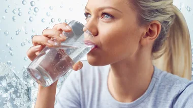 Woman drinking sparkling water