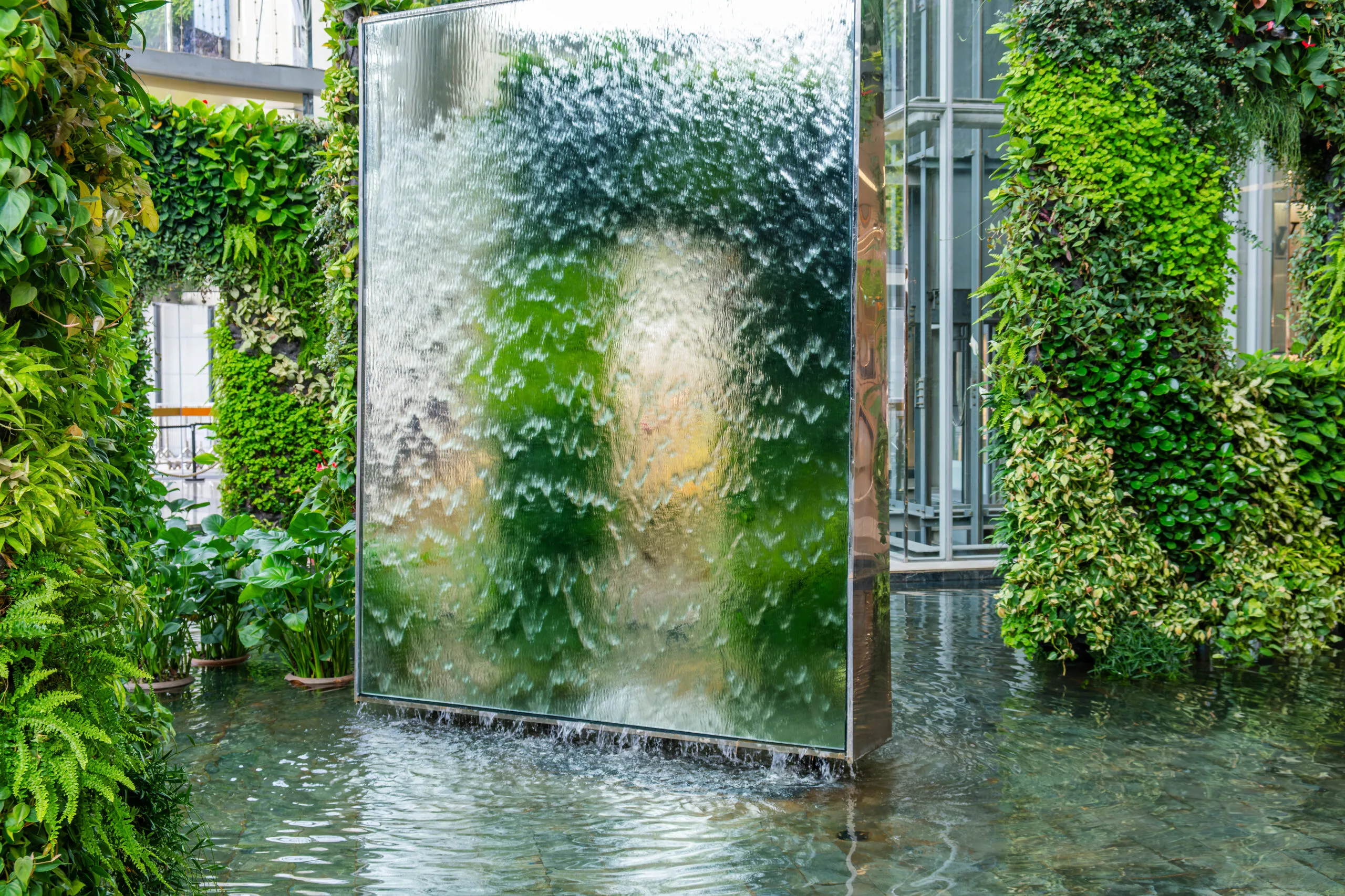 A running water feature wall in a pond.