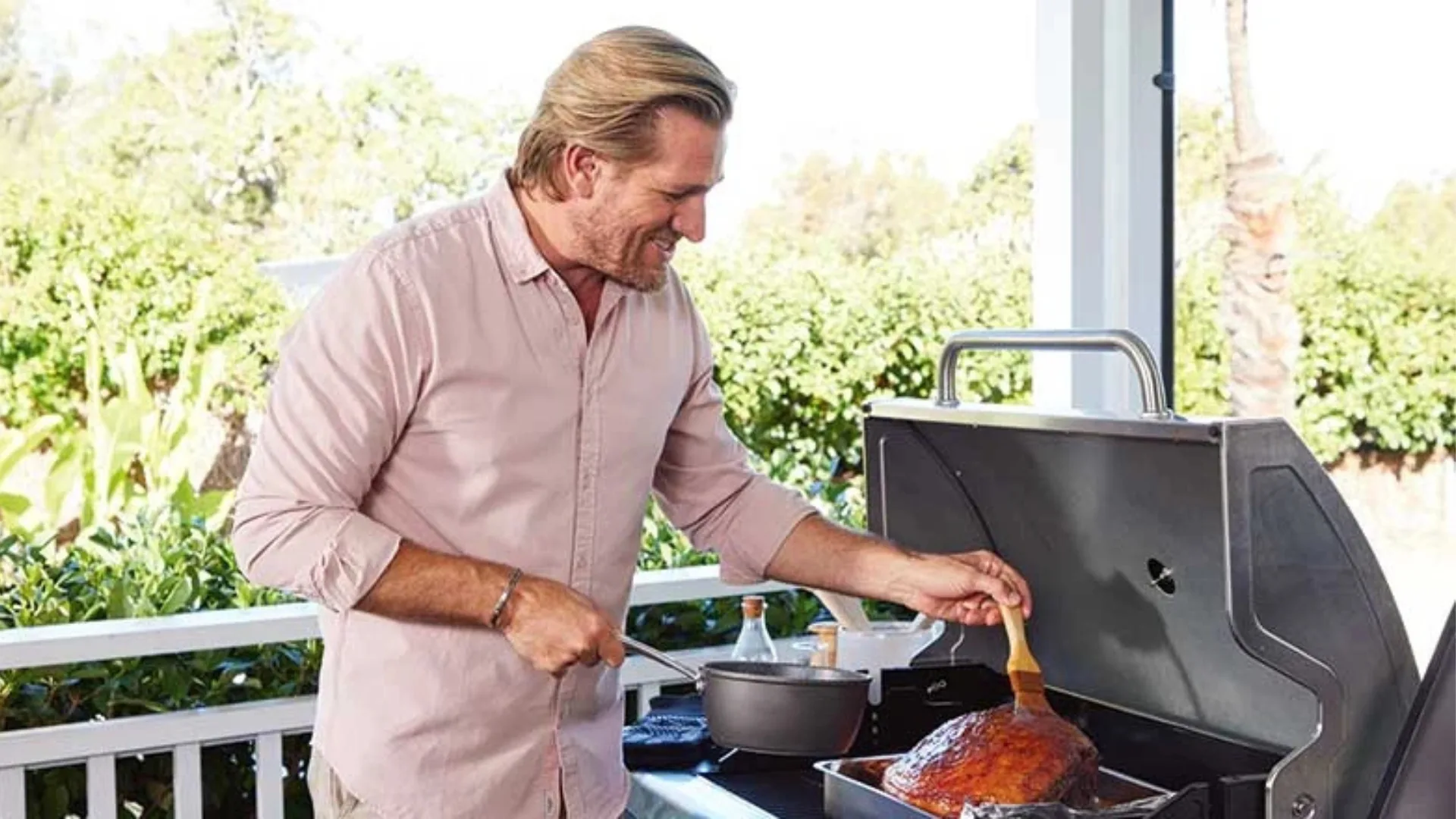 Curtis Stone glazing a Christmas ham