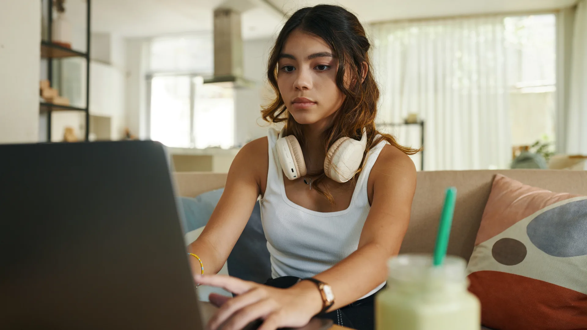 Teenage girl using her laptop