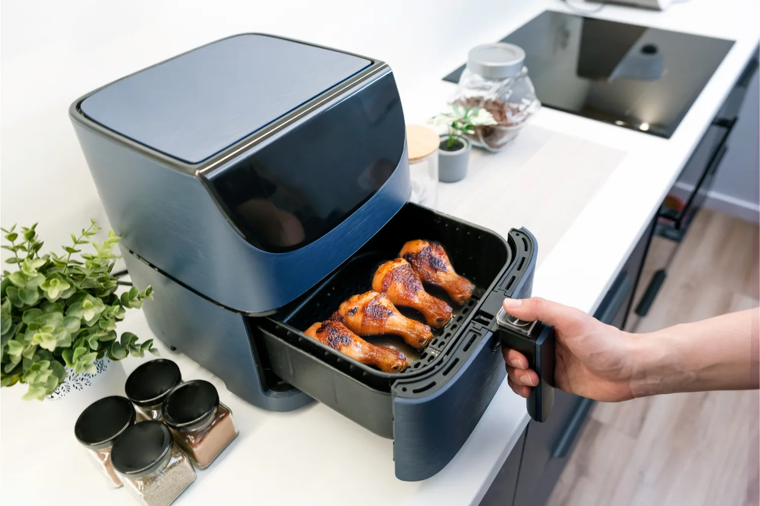 Cooking chicken drumsticks in an air fryer.